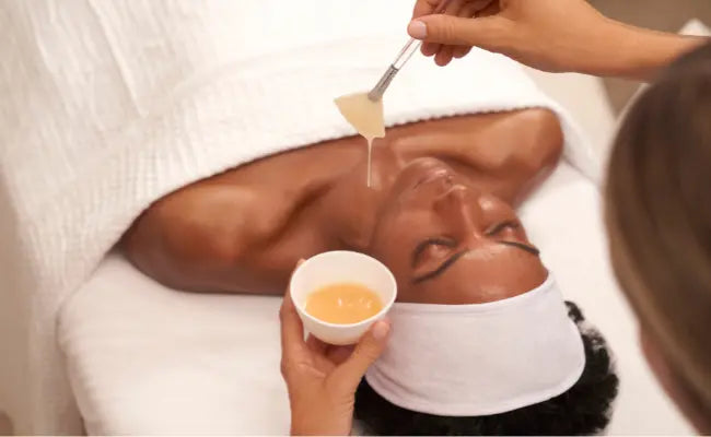 woman receiving image skincare treatment